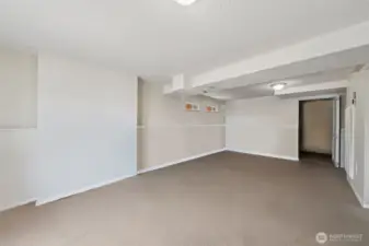 Additional bedroom on lower level with large walk-in closet.  (virtual staging removed items stored in this room)