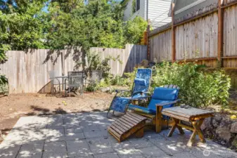 Communal space with stone patio and fruit trees