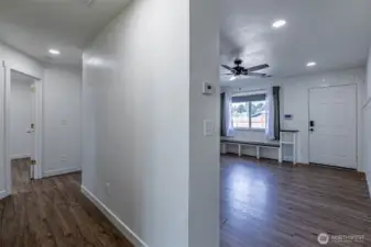 Hallway leads to two other bedrooms, walk in laundry room & full hallway bathroom.