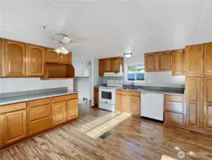 Step inside to find a spacious kitchen featuring lots of cabinets for all your dishes and cooking gadgets.