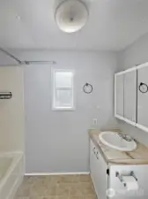 Full bath with shower/tub combo.
