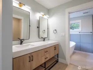 5 piece master bath with updated solid wood cabinets and granite countertops. Radiant heated tile floors.