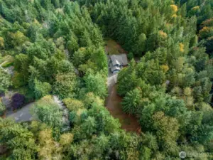 Aerail view of  home and property. 5.6 acres of privacy in the hearth of Suquamish.