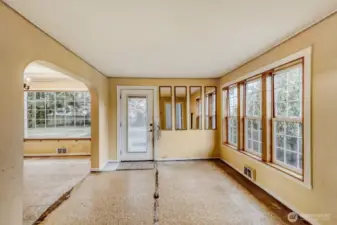 Living room looking towards front door with dining to the left.