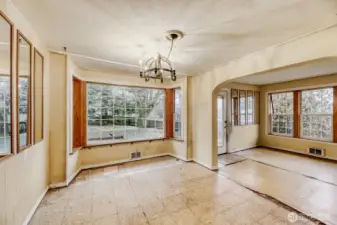Looking out to dining room from the kitchen with living room to the right