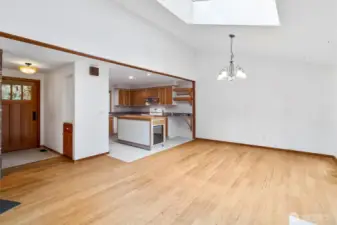 Open space flows into attached dining room and kitchen.