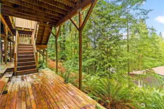 Lower rear deck off basement space.