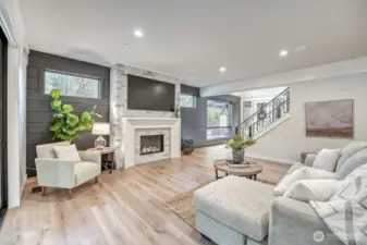 Cozy up in your living room with gas fireplace and overhead speakers to set the vibe