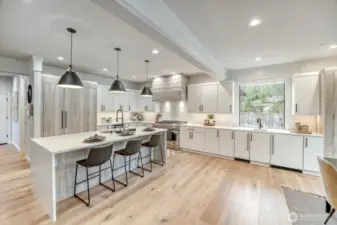 Bright and beautiful kitchen with massive island, counter top space and storage
