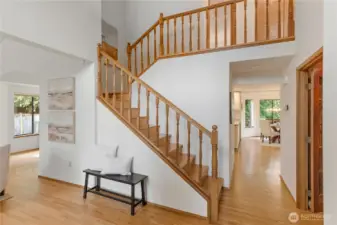 Soaring ceilings and hardwoods greet you as you enter. The office is just to the right, kitchen/family room straight ahead, and the living and dining rooms are to the left.