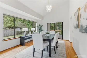 Spacious dining room with generously sized side windows and a slider to the large deck for year-round dining options.