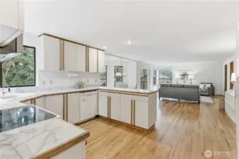 The kitchen anchors the home with an open-concept layout, seamlessly connecting to the casual dining area and the family room, ideal for gathering, conversation, and everyday ease.