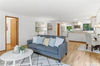 Family room, half bath is on the left. The walk-in pantry is in the kitchen area on the left.