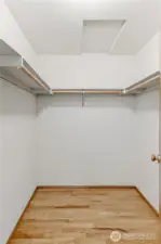 Generously sized primary walk-in closet. Hardwood floor, access to attic in the ceiling.