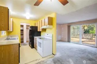 Dining room off of kitchen is open to the living room.