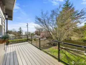 The upper deck is accessible directly from the kitchen and dining area to enjoy the views of Mt Ranier and the sound.