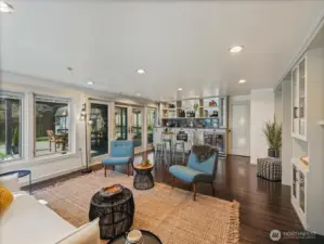 Lower level is suited for a separate living space, featuring a full kitchen and seamless access to an entertainment-sized deck and fully fenced yard.