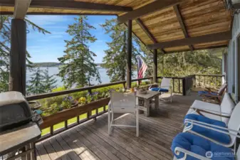 The large, covered porch is perfect for watching the passing ferries.