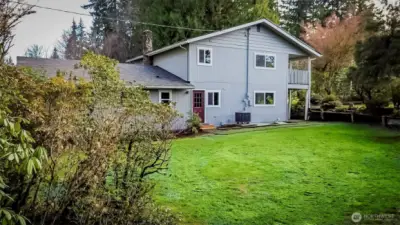 OK...SIDE YARD TOWARD BACK DOOR/UTILITY ROOM