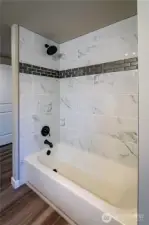 TUB IN PRIMARY....NEW TILE SURROUND