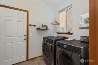Oversized laundry with full size washer & dryer as well as live edge shelves and pantry (not pictured).