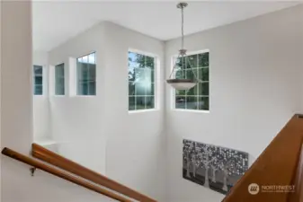 Plenty of windows to show off this bright 2nd floor open foyer and stairwell.