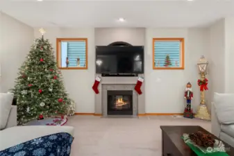 Gas fireplace and 65 inch TV with surround sound stays!