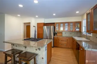 Beautiful kitchen with stainless steel appliances, newer cabinetry and granite countertops.
