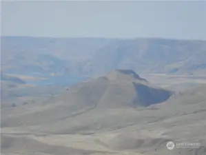 Zoom to Tenas Mtn. and Columbia River above Wells Dam