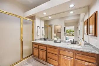 Updated ensuite bathroom featuring a step-in shower for convenience and style.