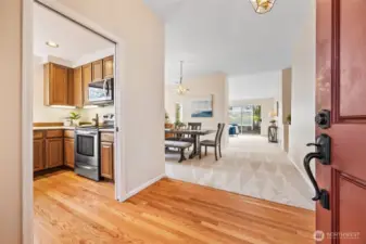 Welcoming entry with hardwood floors and a seamless flow into the home