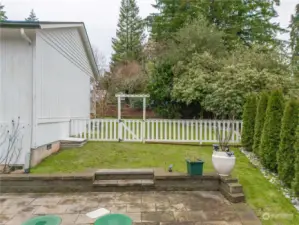 Side yard offers space and trees provide privacy