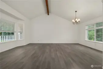 My favorite combo for a living area: newer flooring, exposed beam and lots of natural light