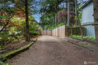 Side drive way with large gate allows for extra parking for cars/trailers/RV's and much more!