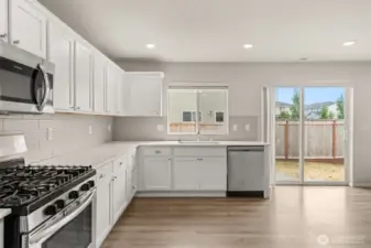 Kitchen and living room overlooks your back yard.