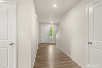Entry way leading you to the main floor bedroom, bathroom, kitchen, and living room.