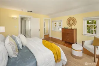 This view from the primary bedroom shows the suite’s hallway, leading to a generous walk-in closet and the ensuite bath.