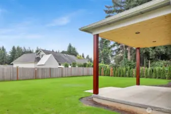 Look at this backyard! South-facing and sun-soaked, it features in-ground irrigation, partial fencing, and a covered patio—perfect for summer BBQs and evening hangouts.