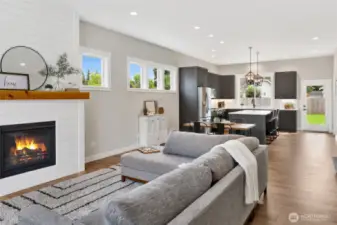 The moment you walk through the front door, you’ll feel the warmth and welcome of this beautifully crafted home. Quality craftsmanship shines throughout, from the gas fireplace with shiplap surround to the open and inviting Great Room—perfect for relaxing or entertaining.