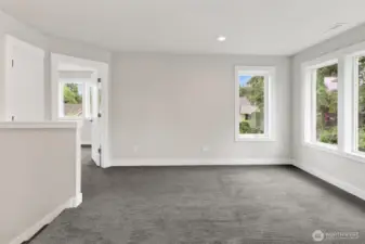 Upstairs, you’ll find a versatile flex space—perfect for a cozy TV lounge, playroom, exercise area, or whatever fits your lifestyle best.