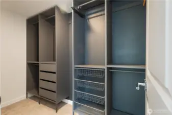 Primary expansive closet with custom shelving
