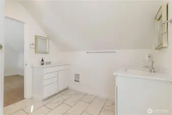 Upper level bathroom with separate vanities