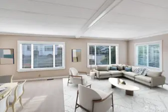 Formal living room area is open and bright! Large vinyl windows with plantation blinds bring in notable natural lighting all day.  Crown melding, updated ceiling, a neutral color scheme, professionally cleaned carpet are just some of the upgrades.