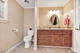 Tastefully updated primary bathroom.  Custom vanity with drawers and cabinets for all your bathing necessities.