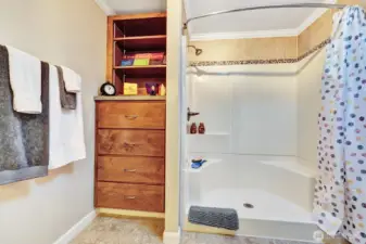 Sparkling clean step in seated shower for your convenience. Built in custom dresser for all bath linens etc.