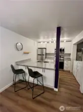 Updated kitchen with quartz countertops, new cabinets and stainless appliances.