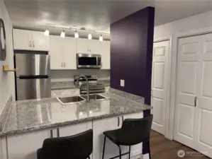 Updated kitchen with quartz countertops, new cabinets and stainless appliances.