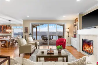 The first impression is the window/slider wall in the entire great room which focuses on the spectacular panoramic Lake Chelan and mountain views.