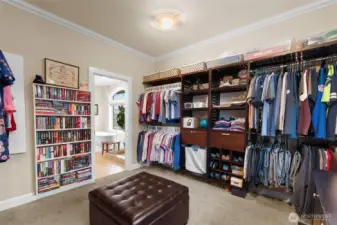 This walk-in closet is so large, it has even been used as an overflow sleeping area! The wall-to-wall closet system on two walls provides lots of storage.
