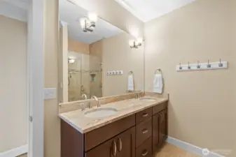 The 3/4 bath located by guest bedrooms 1 &  2 has double sinks and a walk in shower.